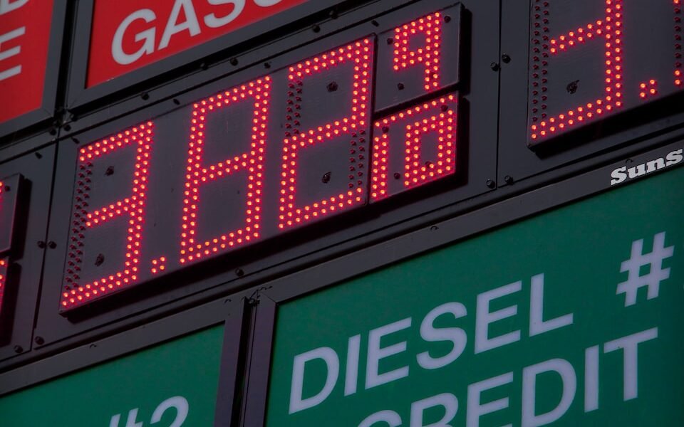 a gas station sign showing diesel and cash