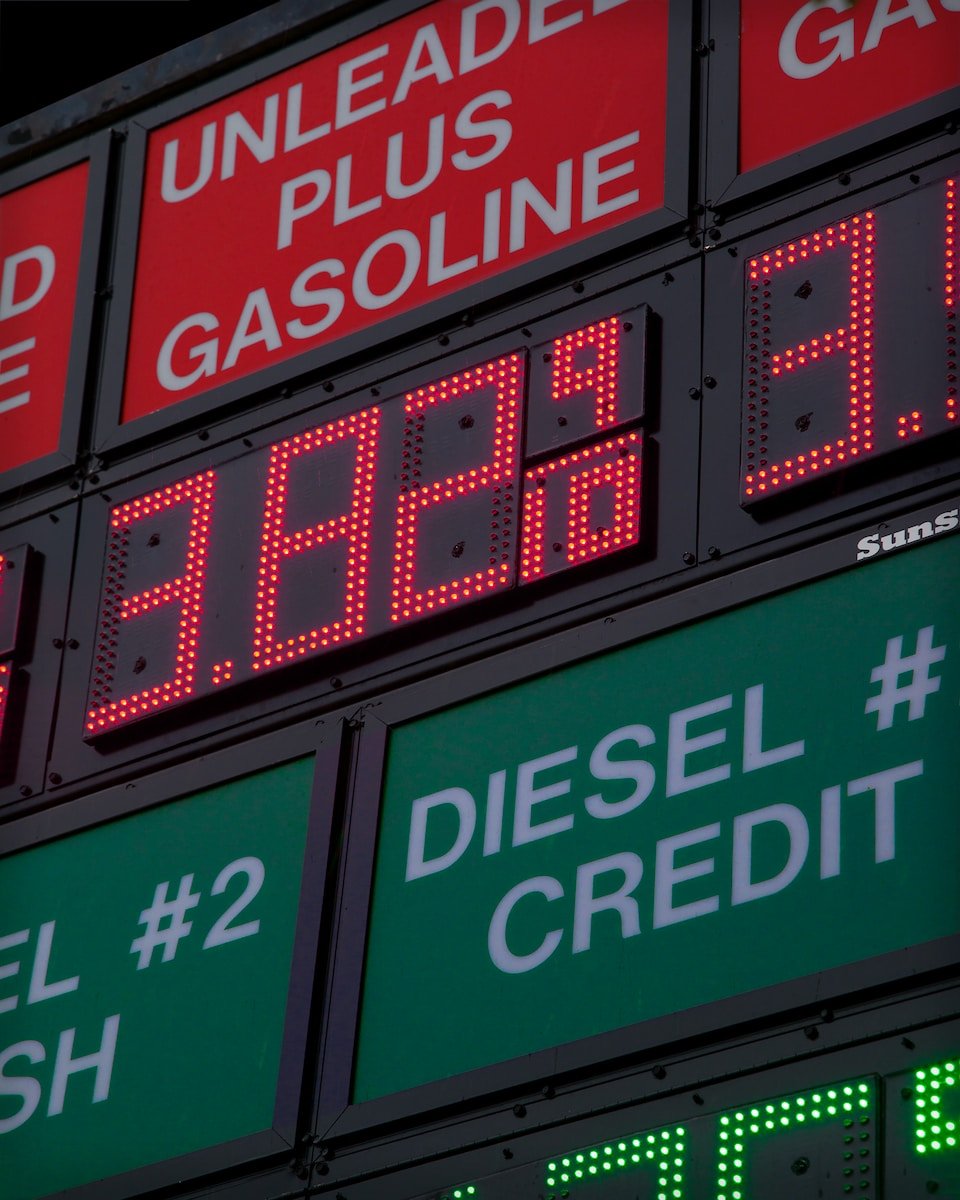 a gas station sign showing diesel and cash