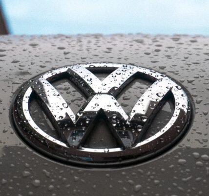 water dew on silver Volkswagen car emblem