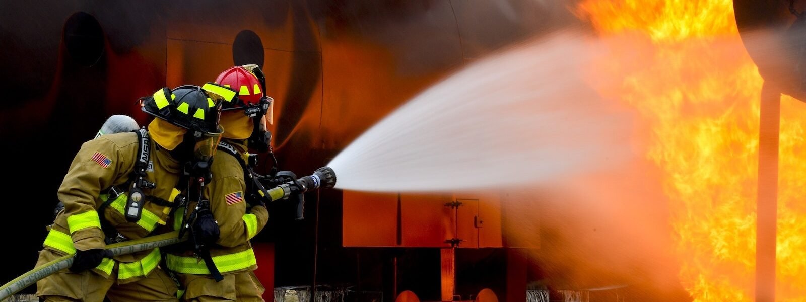 Firemen Blowing Water on Fire