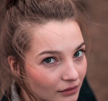 shallow focus photo of woman face